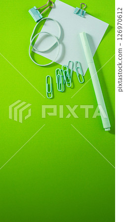 Overhead view of didactic elements arranged on a smooth, glossy background.Large vertical shot 126970612