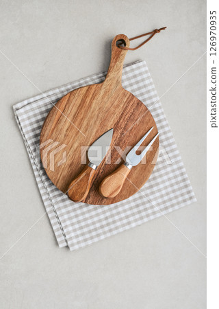 Cheese knife set and circle wooden board with handle 126970935