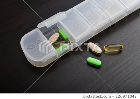7-Day Pill Organizer with Contoured Bottoms. 126971042