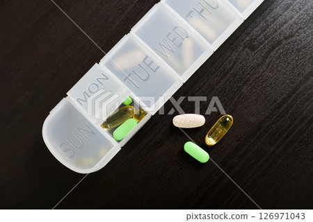 7-Day Pill Organizer with Contoured Bottoms. 126971043