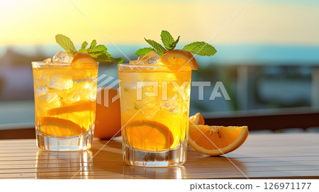 A Toast to Summer: Two Glasses of Orange Refreshment 126971177