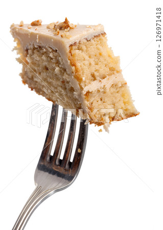 Slice of cake on fork isolated on transparent background, delicious dessert, sweet treat, food close-up Slice of cake on fork isolated on transparent background, delicious dessert, sweet treat, food close-up 126971418