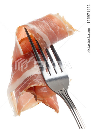 Prosciutto on fork isolated on transparent background, italian cured ham, thin slices, gourmet food, appetizer Prosciutto on fork isolated on transparent background, italian cured ham, thin slices, gourmet food, appetizer 126971421