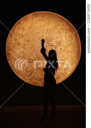 A Stunning Silhouette Set Against a Magnificent Moonlit Backdrop That Captivates the Eye 126971608