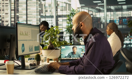 Business manager on videocall with worker attending briefing meeting to share new ideas to profit growth. Specialist in online telework call using tablet to explain startup evolution vision, camera B 126972272