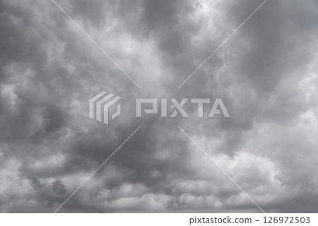 Rain cloud in the sky. Background of dark clouds before thunder storm and rain. Abstract dramatic clouds sky. 126972503