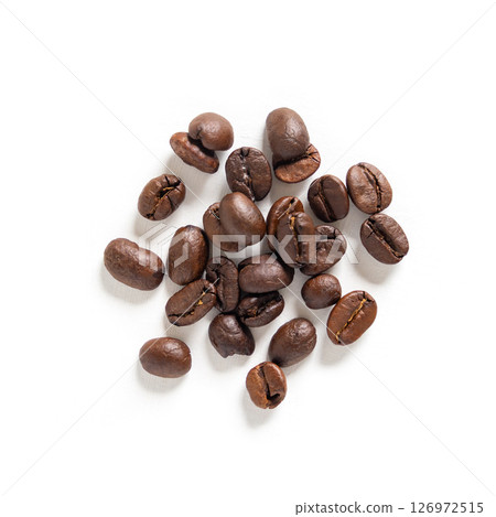 Coffee beans seeds on white background. Close up image. Coffee beans seeds on white background. Close up image. 126972515