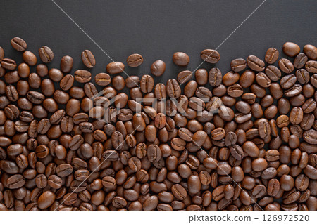 Coffee beans background. Top view coffee beans with copy space area for your text. Close up image. Coffee beans background. Top view coffee beans with copy space area for your text. Close up image. 126972520