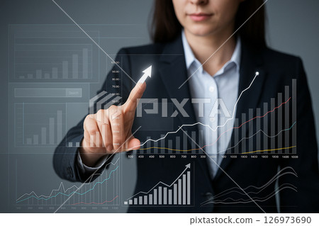AI generated image of a professional woman in a suit interacting with a holographic display of rising bar charts lines and interface icons representing business growth and digital analysis 126973690