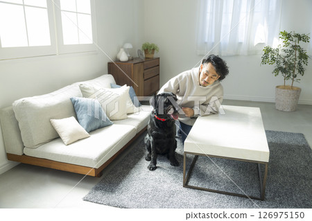 Man relaxing with his dog 126975150