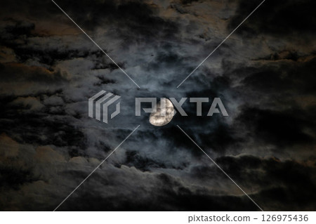 The moon floating in the dark night The moon floating in the dark night 126975436