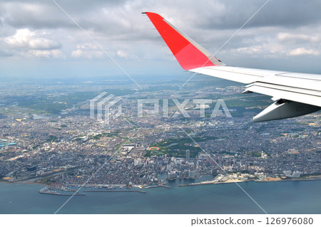 View from the plane: Descending altitude to Kobe Airport, over Akashi City 126976080