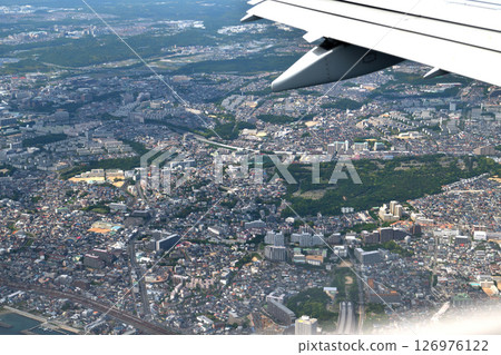 View from the plane: Descending altitude to Kobe Airport, over the Akashi Kaikyo Bridge 126976122
