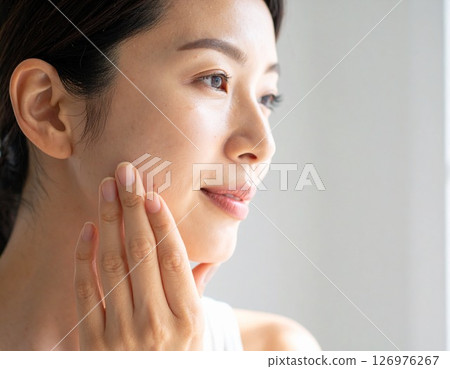 Woman to check skin condition 126976267
