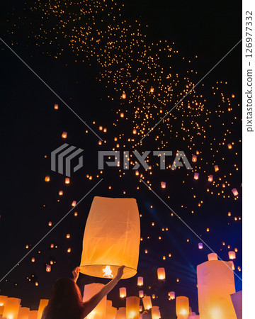 Tourist floating sky lanterns in Loy Krathong festival , Chiang Mai ,Thailand. 126977332