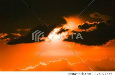 A mysterious image of the evening sky and clouds turning red A mysterious image of the evening sky and clouds turning red 126977656