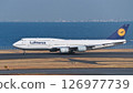 A German Lufthansa passenger plane takes off from runway C at Haneda Airport. 126977739