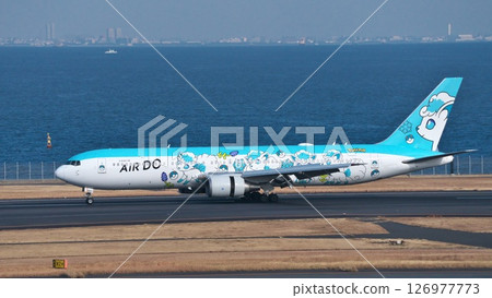 Air Do anime passenger plane about to take off from runway C at Haneda Airport 126977773