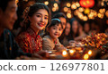 warm family gathering during Chinese New Year dinner, filled with joy, delicious food, and the glow of lanterns, celebrating traditions, unity, and the beauty of togetherness in a festive atmosphere. 126977801