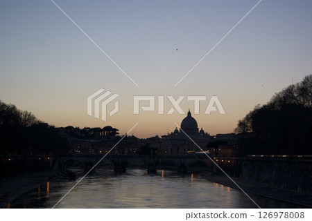 Evening view of St. Peter's Basilica silhouetted across the Tiber River Evening view of St. Peter's Basilica silhouetted across the Tiber River 126978008