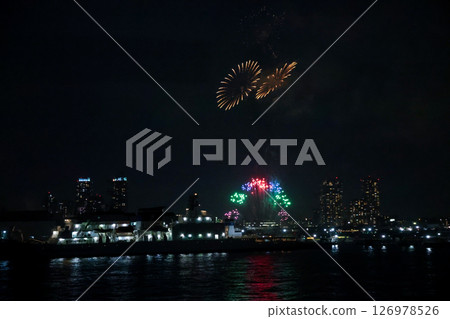 Fireworks display over Yokohama Port during a lively festival celebration at night 126978526