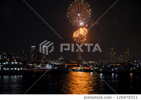 Fireworks display over Yokohama Port during a lively festival celebration at night Fireworks display over Yokohama Port during a lively festival celebration at night 126978551