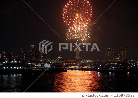 Fireworks display over Yokohama Port during a lively festival celebration at night 126978552