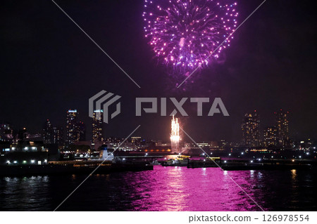 Fireworks display over Yokohama Port during a lively festival celebration at night 126978554