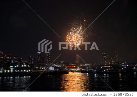 Fireworks display over Yokohama Port during a lively festival celebration at night Fireworks display over Yokohama Port during a lively festival celebration at night 126978555