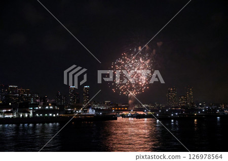 Fireworks display over Yokohama Port during a lively festival celebration at night 126978564