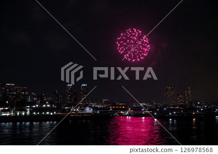 Fireworks display over Yokohama Port during a lively festival celebration at night 126978568