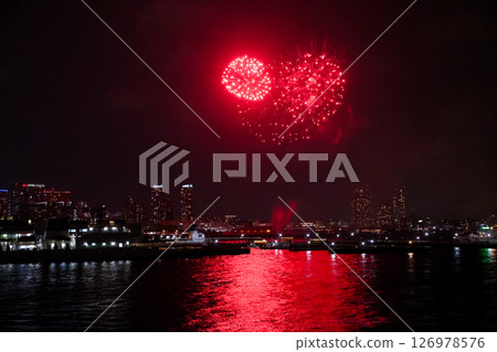 Fireworks display over Yokohama Port during a lively festival celebration at night Fireworks display over Yokohama Port during a lively festival celebration at night 126978576
