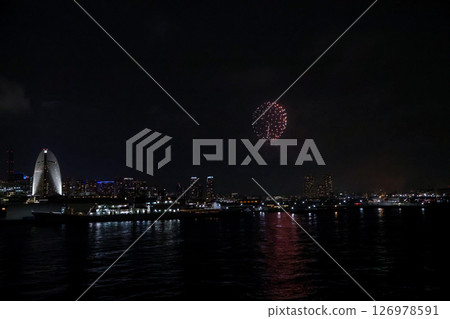 Fireworks display over Yokohama Port during a lively festival celebration at night 126978591