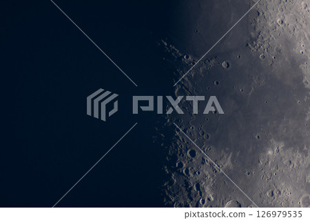 Close-up view of the moon's craters along lunar terminator. 126979535