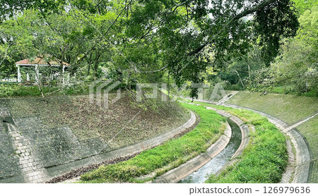 Outdoor catchwater , aqueduct construction, green grass, trees in Hong Kong Outdoor catchwater , aqueduct construction, green grass, trees in Hong Kong 126979636