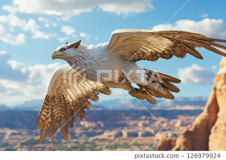 Majestic eagle soaring over a dramatic landscape with mountains and clouds 126979924