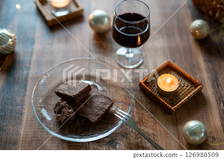 Chocolate cake and red wine for an adult evening Chocolate cake and red wine for an adult evening 126980509