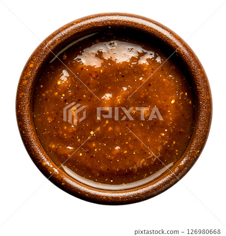 Rich and Spicy Brown Sauce in a Rustic Bowl on a Dark Background 126980668