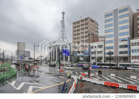 March 28 2025 Urban Tram Station with Travelers and City Traffic March 28 2025 Urban Tram Station with Travelers and City Traffic 126980983