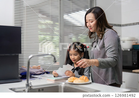 Mother-Daughter Bonding: Learning Together in the Kitchen Mother-Daughter Bonding: Learning Together in the Kitchen 126981492