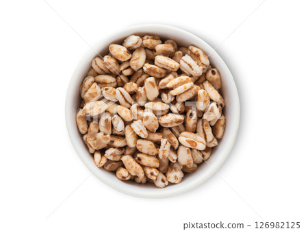 Top view bowl with honey rice crispies breakfast cereal on white.Macro. Top view bowl with honey rice crispies breakfast cereal on white.Macro. 126982125