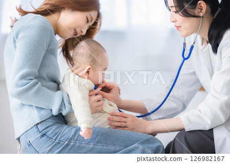Baby receiving medical examination 126982167