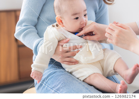 Baby receiving medical examination Baby receiving medical examination 126982174