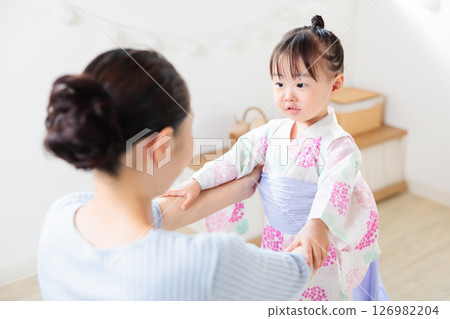 A 2-year-old girl wearing a yukata. Children's yukata dressing 126982204