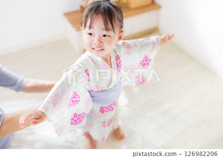 Girl wearing a yukata Girl wearing a yukata 126982206