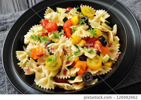 salad of farfalle pasta with veggies and olives 126982662