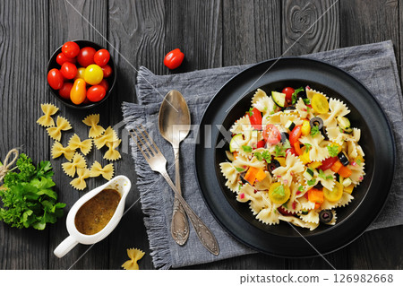 salad of farfalle pasta with veggies and olives salad of farfalle pasta with veggies and olives 126982668