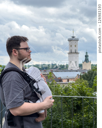 Father Holding Baby in Cityscape Father Holding Baby in Cityscape 126983193