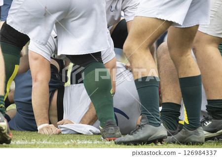 Rugby players competing for the ball during a ruck 126984337