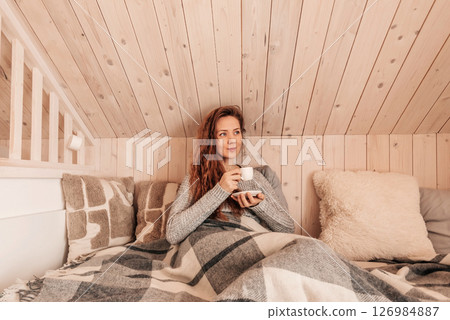 Happy Woman Drinking Morning Coffee in Bed Happy Woman Drinking Morning Coffee in Bed 126984887